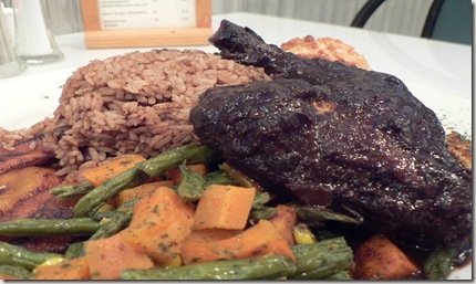 A dish of Caribbean Cuisine, including chicken cooked with Jamaican jerk spice